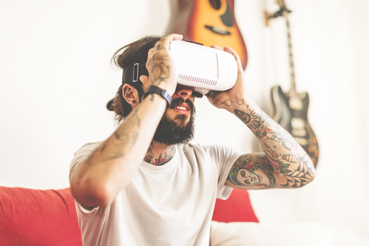 Man using virtual reality headset to represent virtual reality and marketing