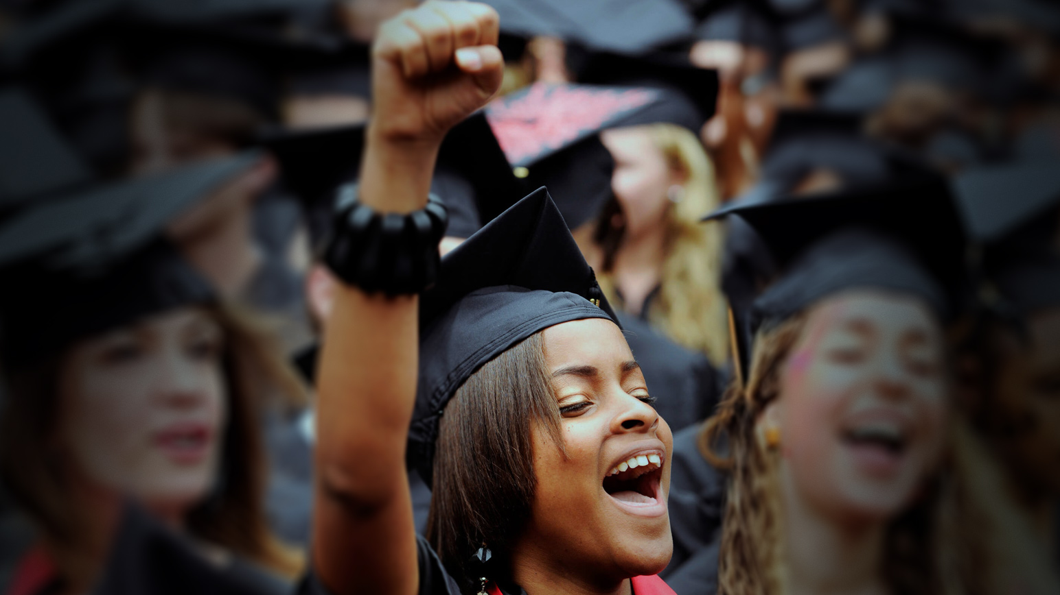 Group of excited graduates to represent a college choice survey