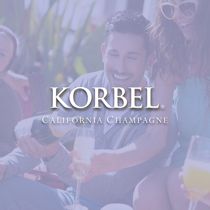 Korbel California Champagne consumer image of group enjoying Korbel in an outdoor setting