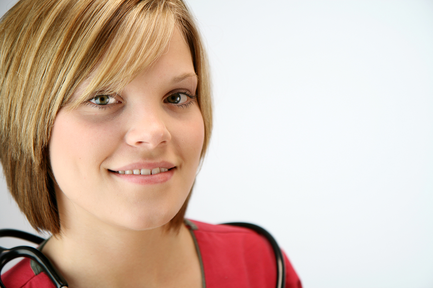 Headshot of smiling nurse to represent best practices in healthcare recruitment marketing