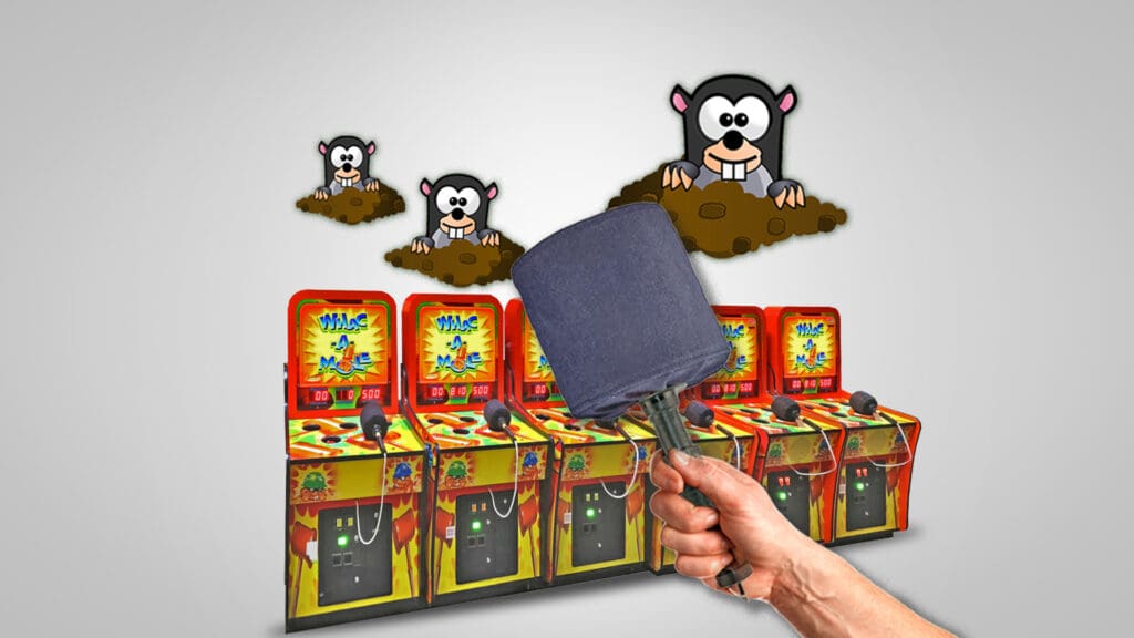 Hand holding Whack-A-Mole mallet, representing SEO competitor analysis for competitive blunting