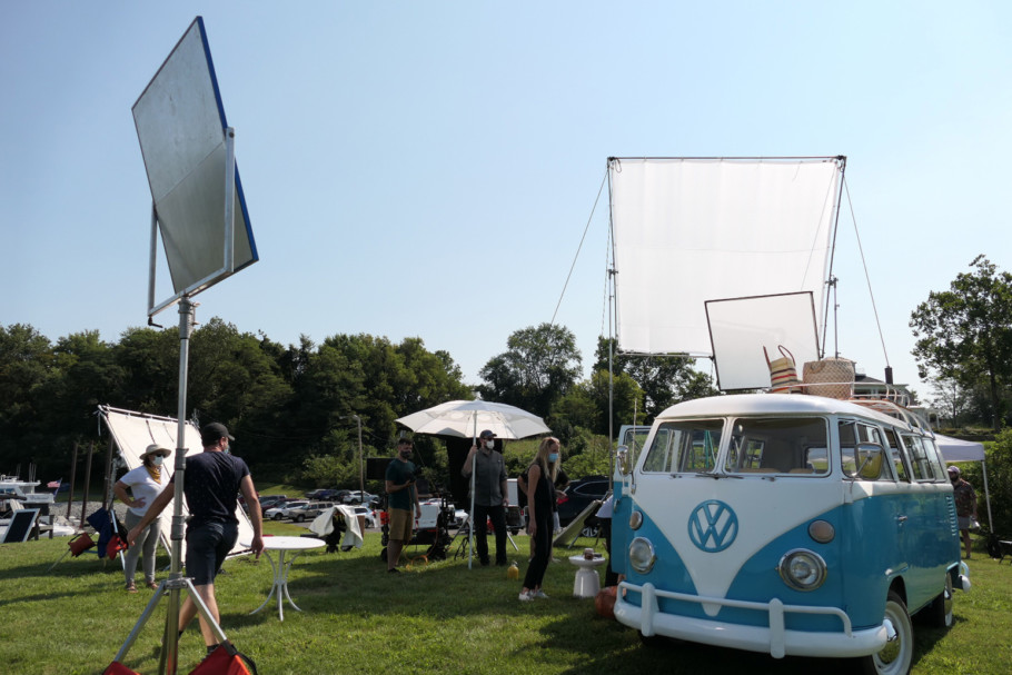 VW bus parked outside surrounded by photography equipment