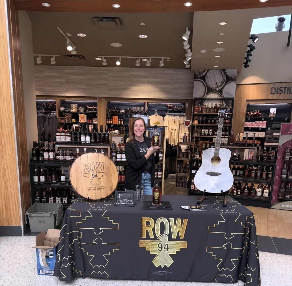 ROW 94 retail display with barrel and guitar at a Kentucky location